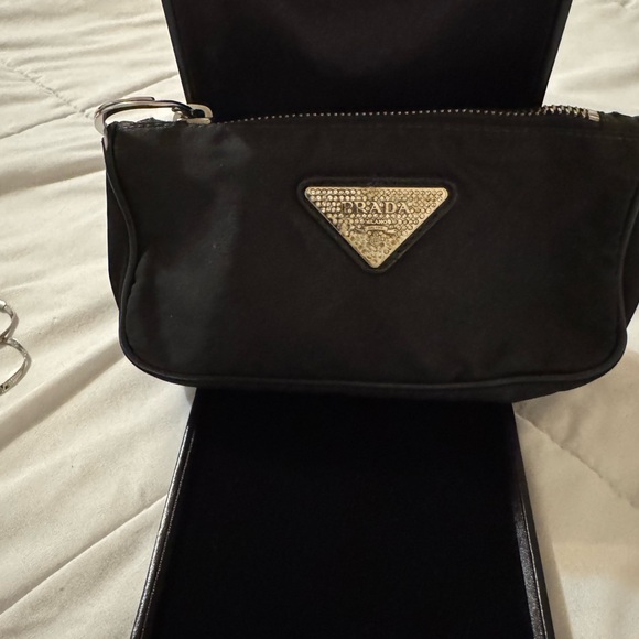 Prada Handbags - Prada Black Nylon Cosmetic Wrist Pouch with Silver Triangle Logo
